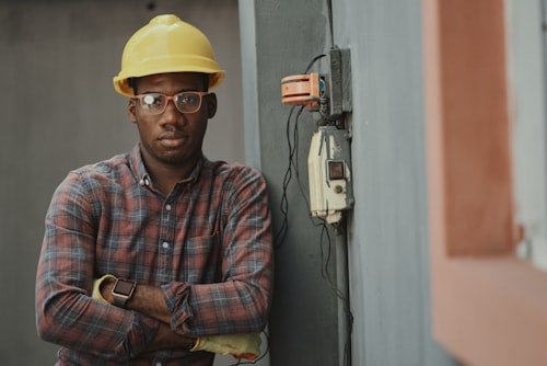 Solar technician inspecting panels with tablet